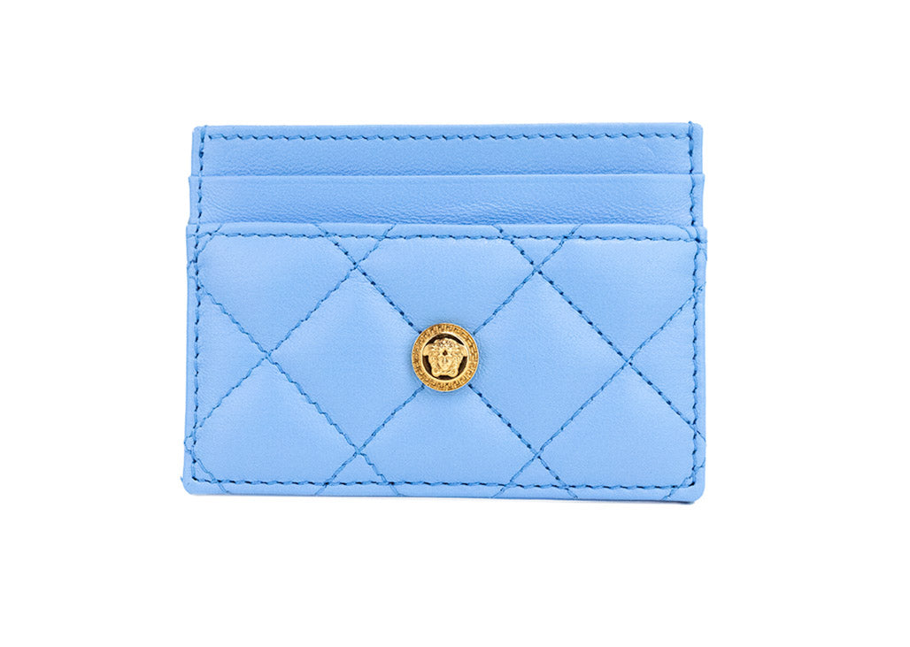 versace mini dv blue quilted card case on white background