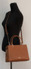 Kate Spade Leila warm gingerbread satchel on mannequin