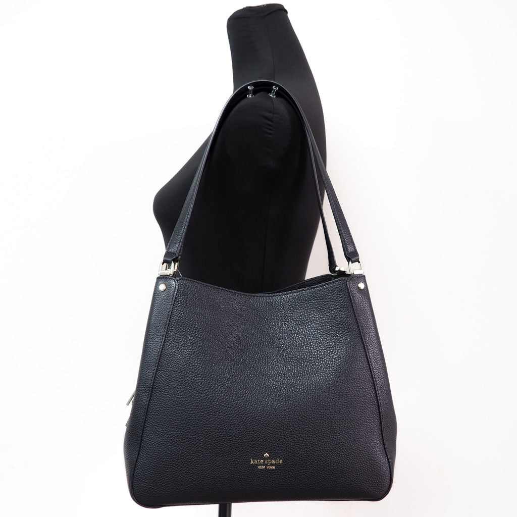 Kate Spade Leila black triple compartment satchel on mannequin