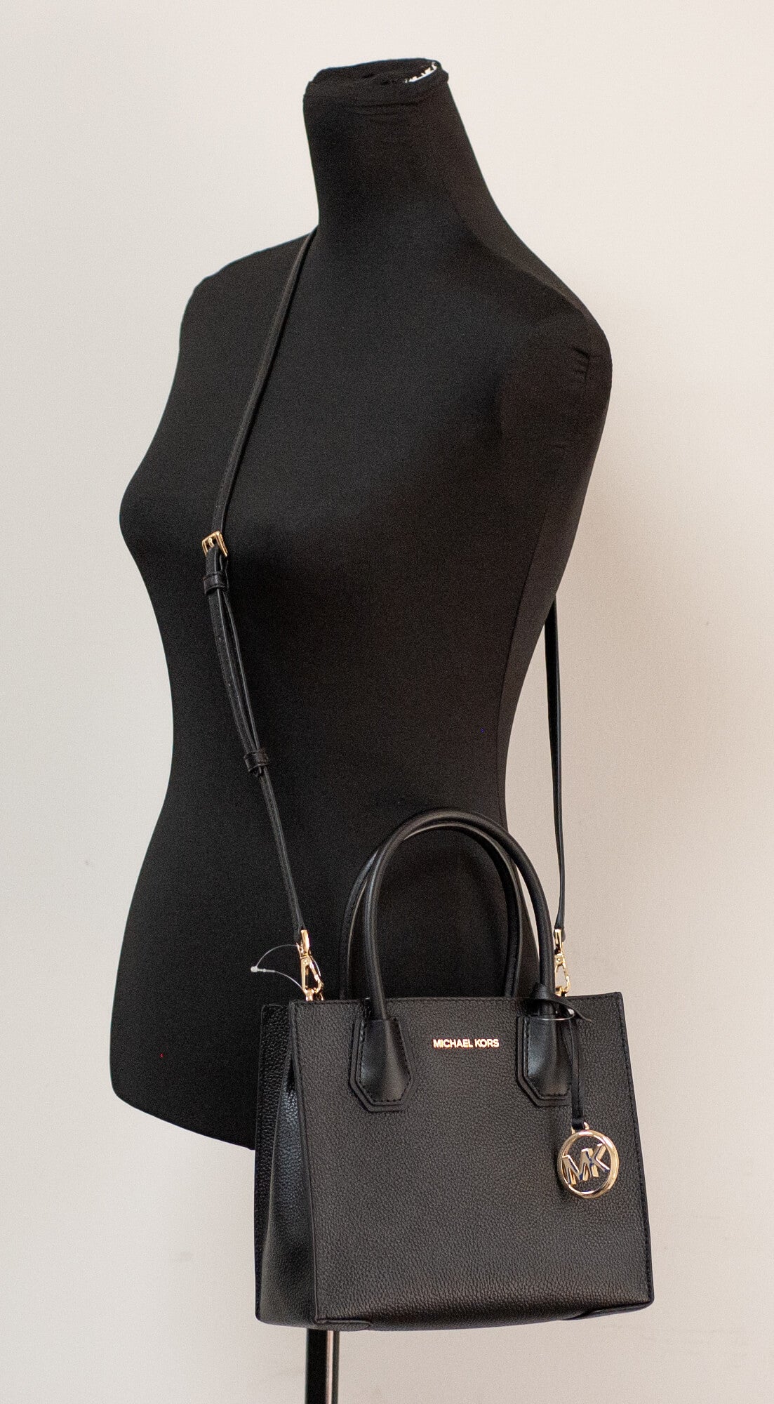 Michael Kors mercer black messenger bag on mannequin