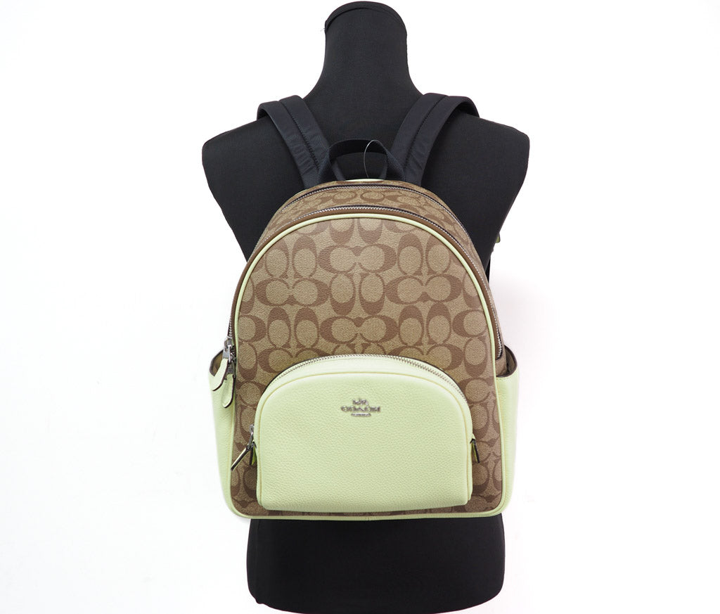Coach Court khaki pale lime backpack on mannequin