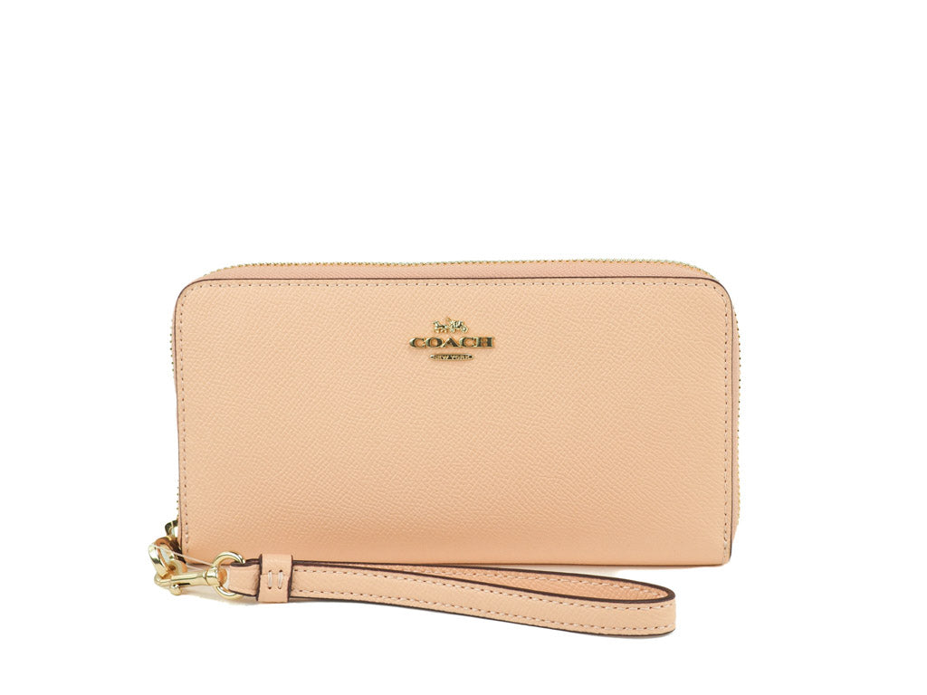 Coach faded blush long zip around wallet on white background