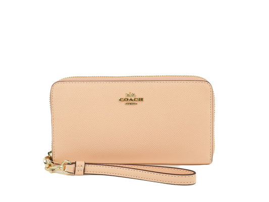 Coach faded blush long zip around wallet on white background