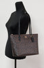 Coach brown black tote on mannequin