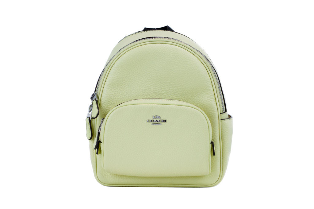 Coach Court pale lime mini backpack on white background