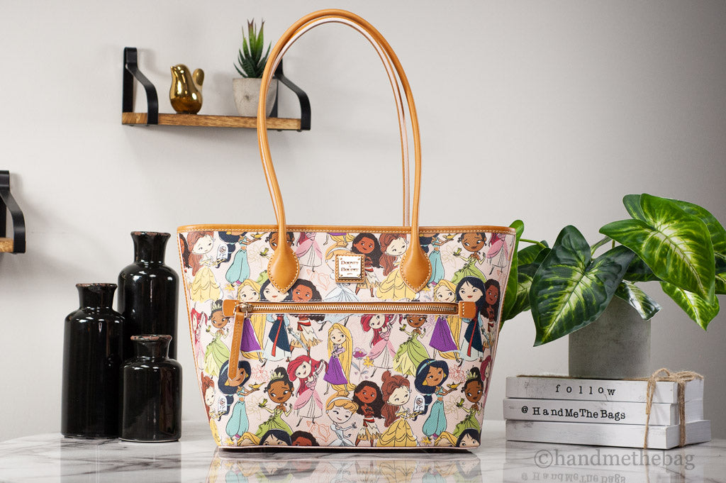 Dooney & Bourke Disney Princess tote on marble table