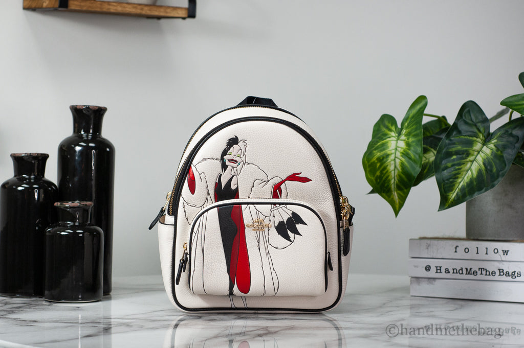 Coach X Disney Cruella mini court backpack on marble table