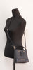 Michael Kors Mercer black bucket crossbody on mannequin