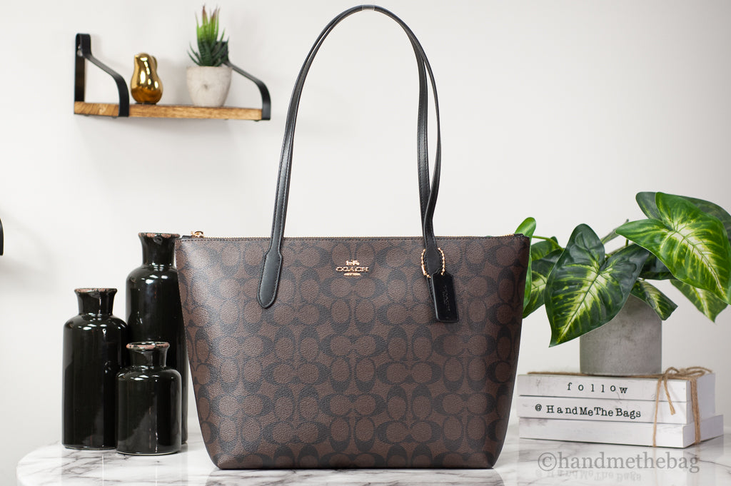 Coach brown black tote on marble table