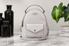 Kate Spade Schuyler gray mini backpack on marble table
