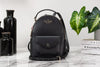 Kate Spade Schuyler black mini backpack on marble table
