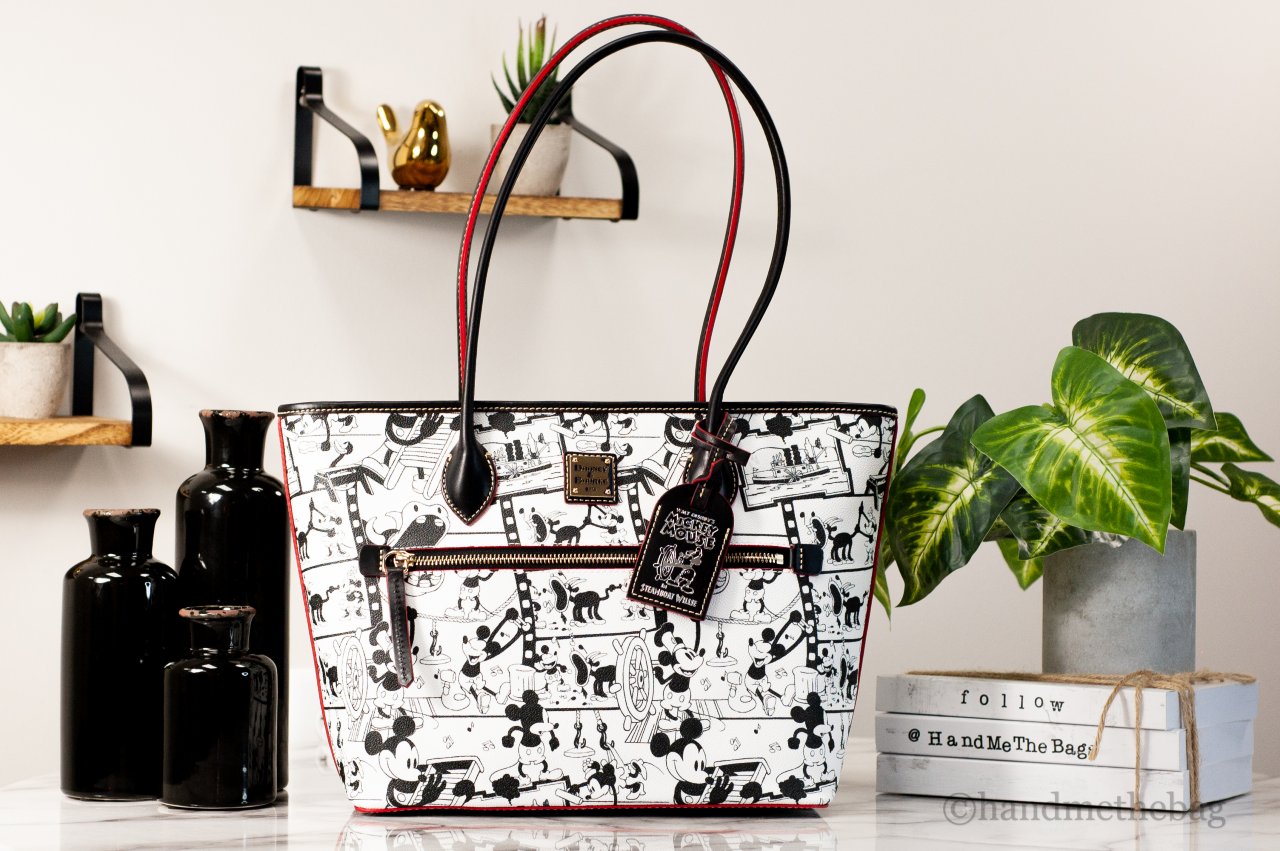 Dooney & Bourke Steamboat Willie tote on marble table