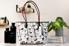 Dooney & Bourke Steamboat Willie tote back on marble table
