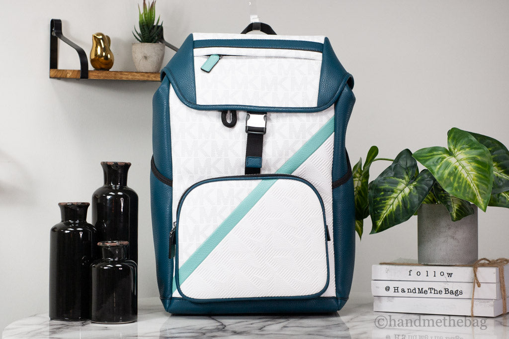 Michael Kors Cooper lagoon flap backpack on marble table