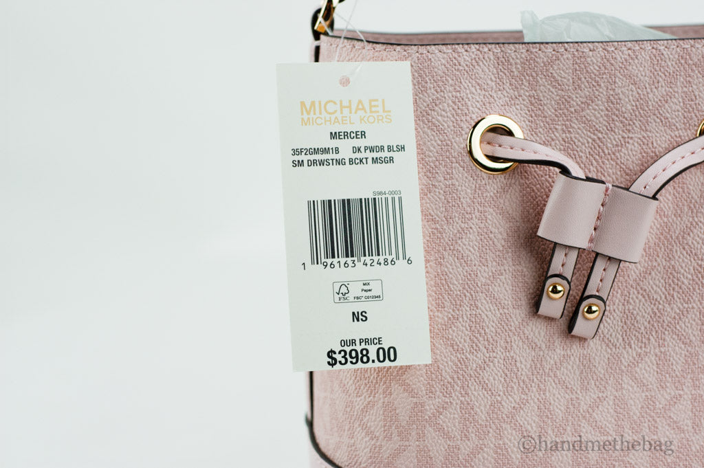 Michael Kors Mercer powder blush bucket crossbody tag on white background