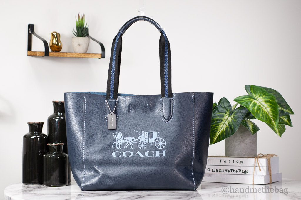 Coach Derby navy tote on marble table
