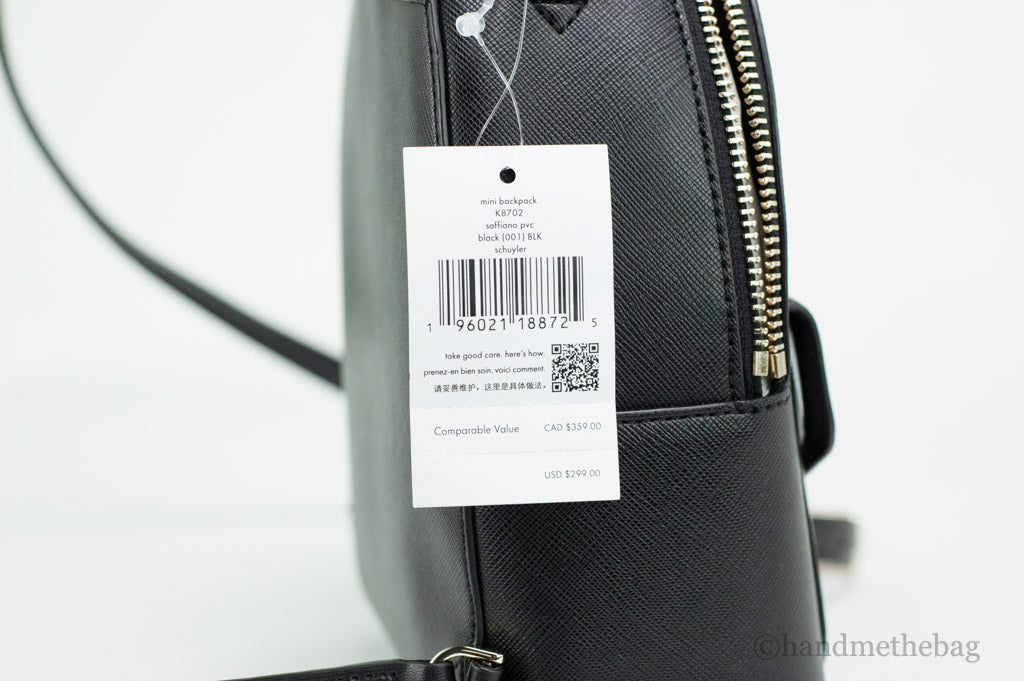 Kate Spade Schuyler black mini backpack tag on white background