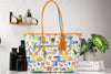 Dooney & Bourke Jungle Book tote on marble table