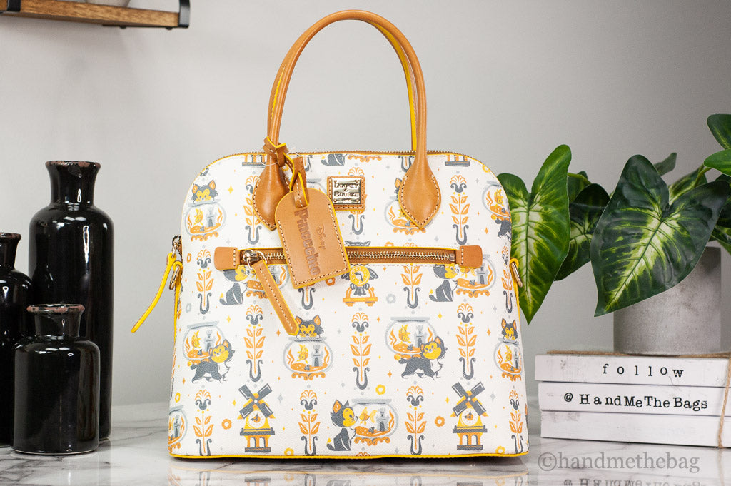 Dooney & Bourke Pinocchio satchel on marble table