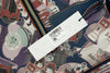 Dooney & Bourke haunted mansion tote tag on white background