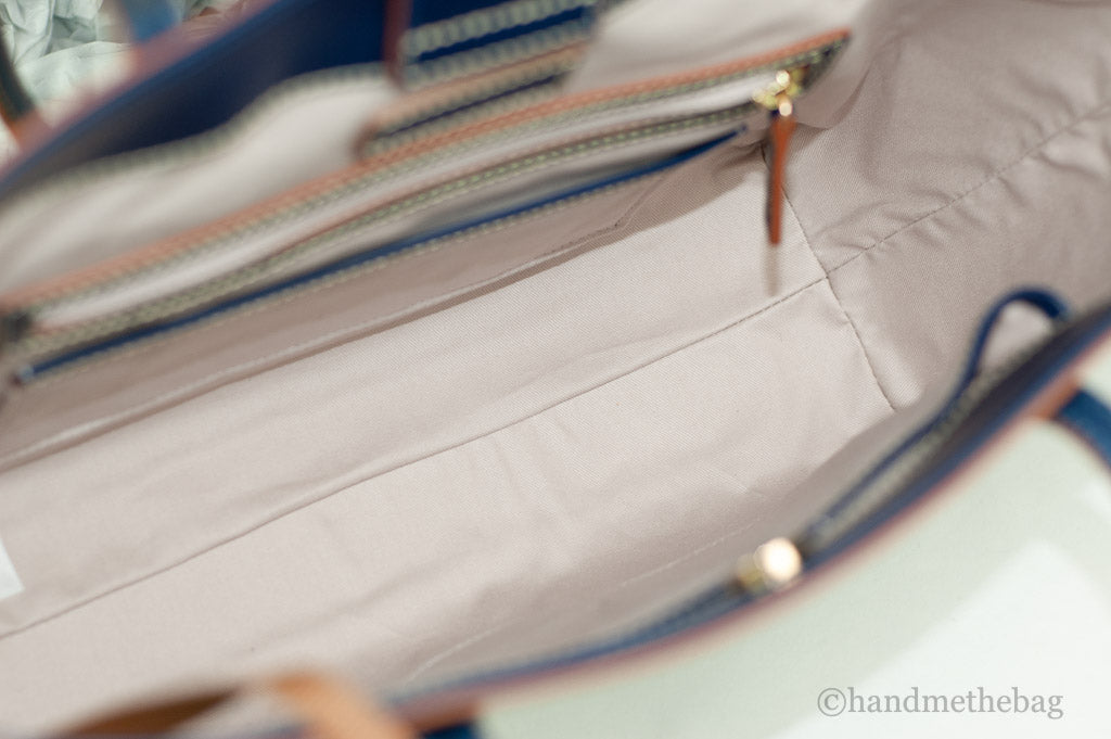 Dooney & Bourke haunted mansion tote inside on white background