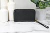 Michael Kors jet set black phone wallet back on marble table