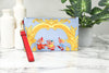 Versace X Disney cinderella pouch on marble table
