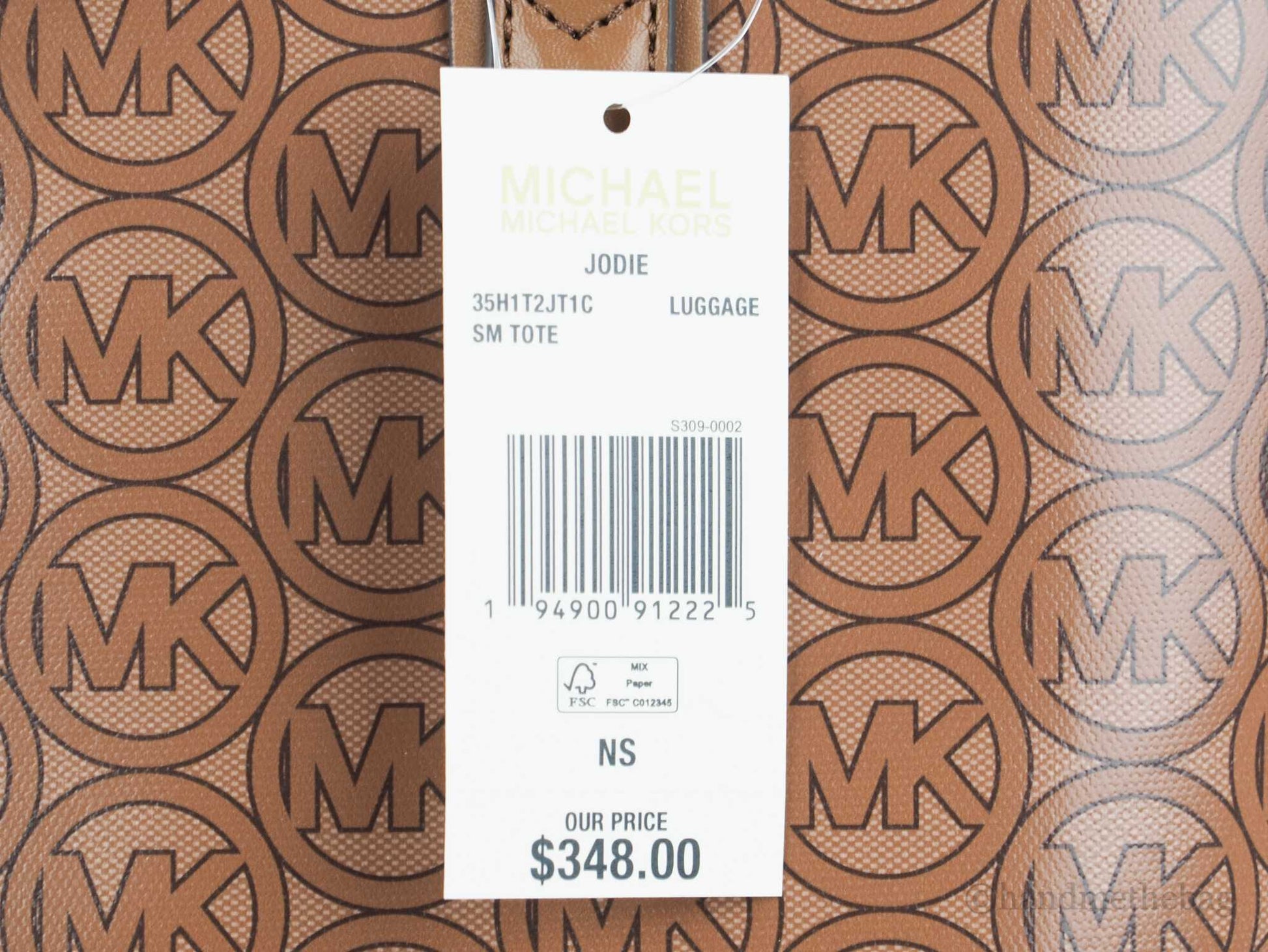 Michael Kors jodie luggage recycled tote tag on white background