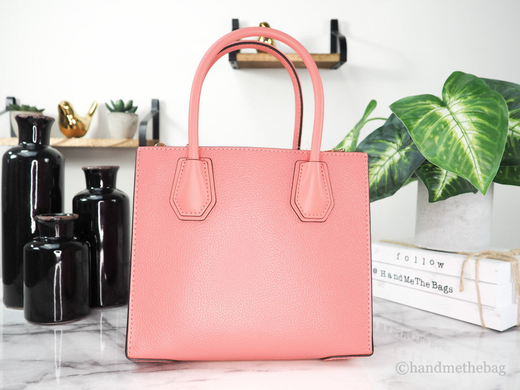michael kors mercer grapefruit messenger crossbody back on marble table