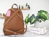 Kate Spade leila gingerbread dome backpack back on marble table