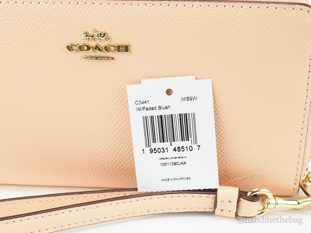 Coach faded blush long zip around wallet tag on white background