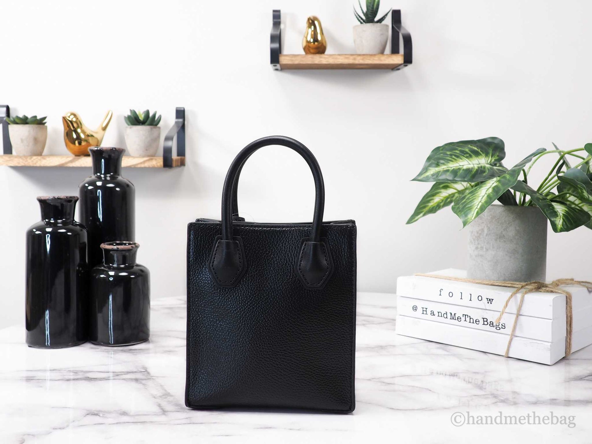 Michael Kors mercer black north south shopper bag back on marble table