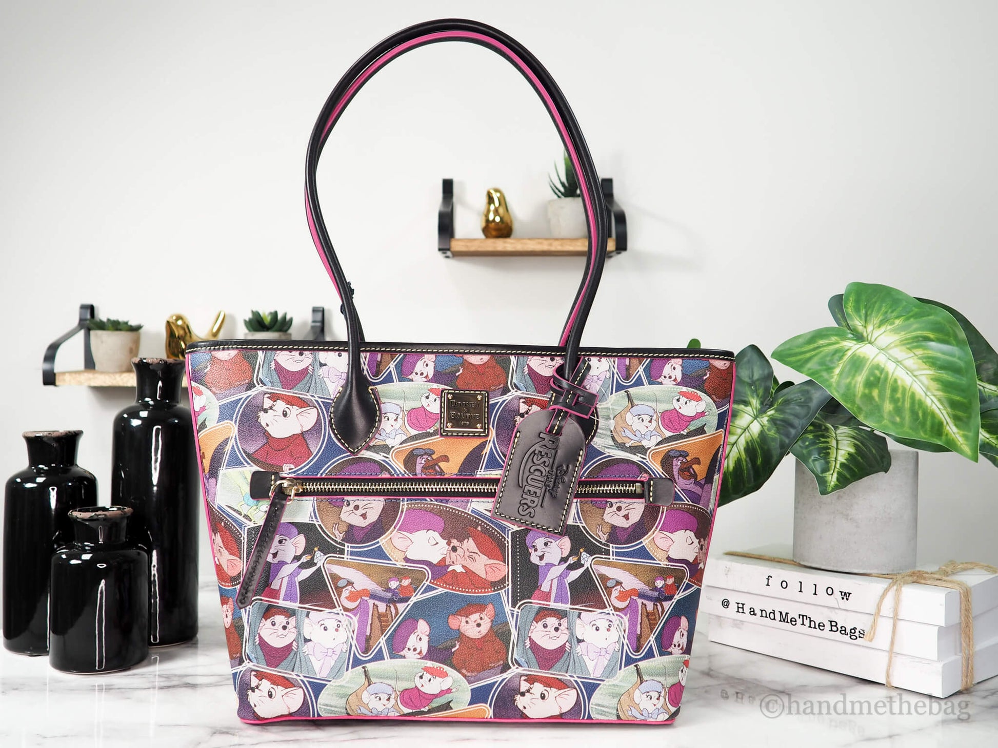 Dooney and Bourke Rescuers tote on marble table