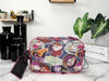 Dooney & Bourke The Rescuers crossbody bag back on marble table