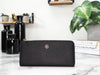 Tory Burch emerson black l-zip wallet on marble table
