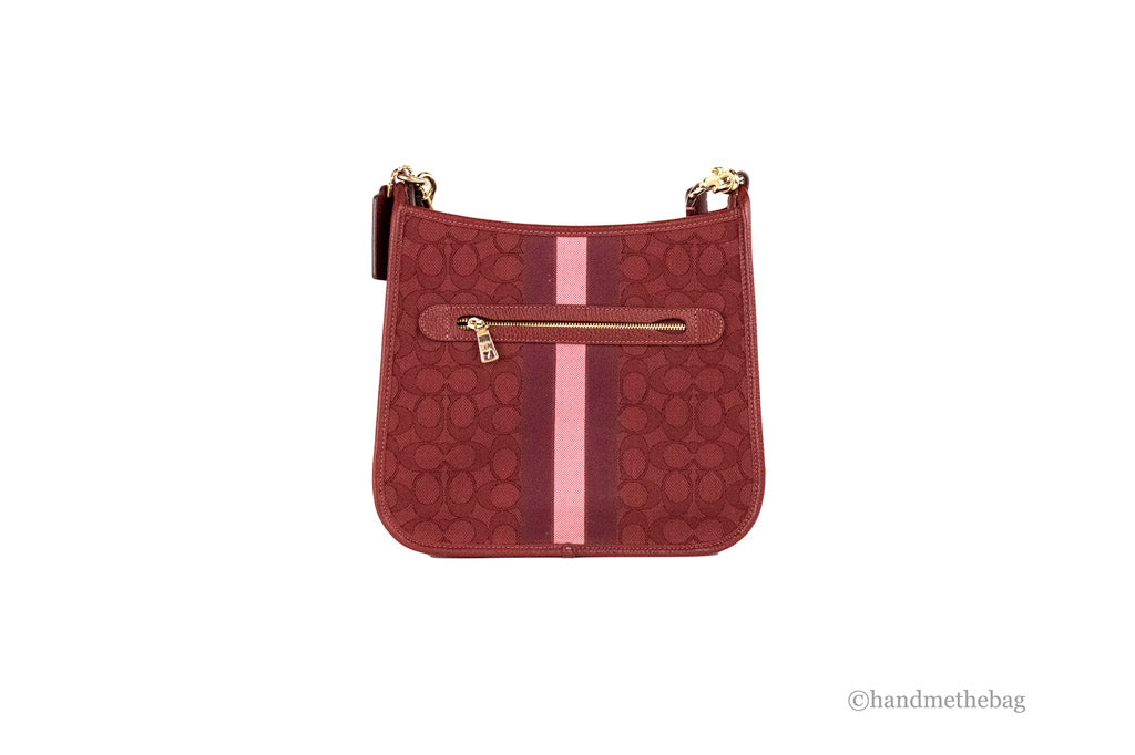 coach dempsey red apple file crossbody back on white background
