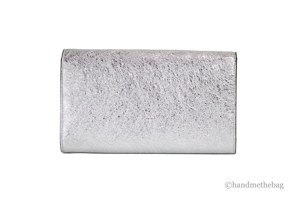 versace small metallic silver evening bag back on white background