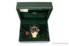 bapex type 1 gold tone black dial watch in box on white background
