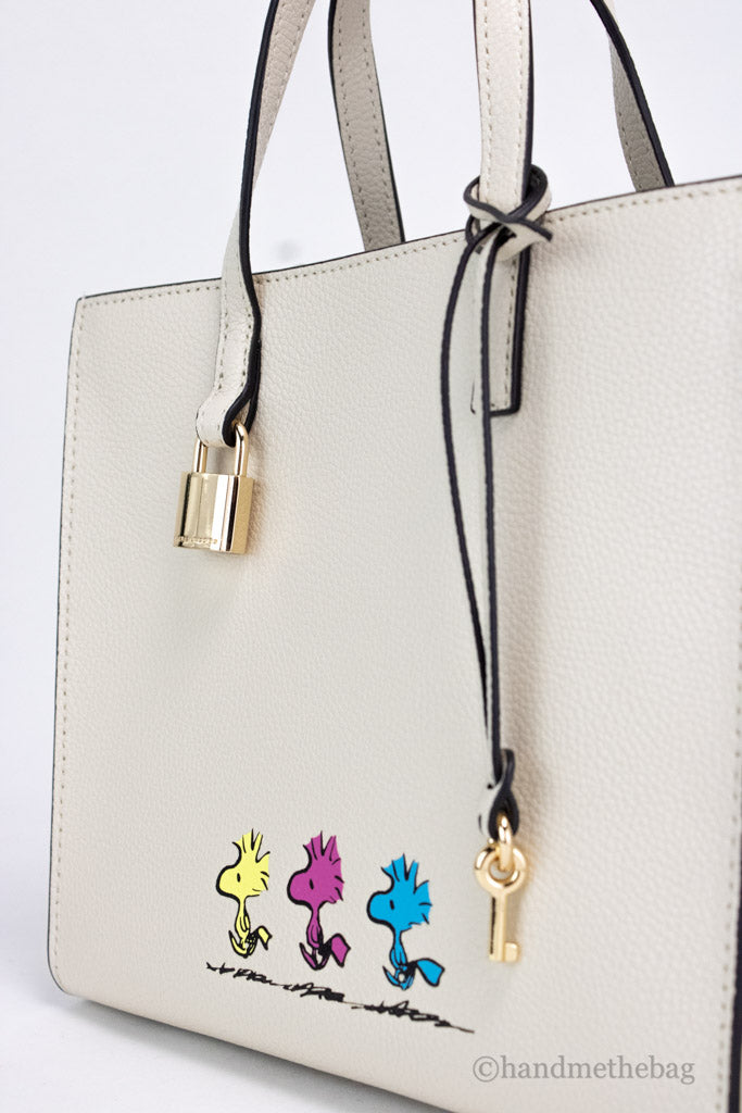 marc jacobs x peanuts woodstock tote detail on white background