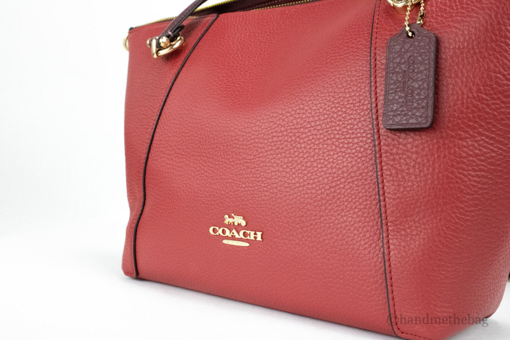 coach kacey colorblock red apple satchel detail on white background