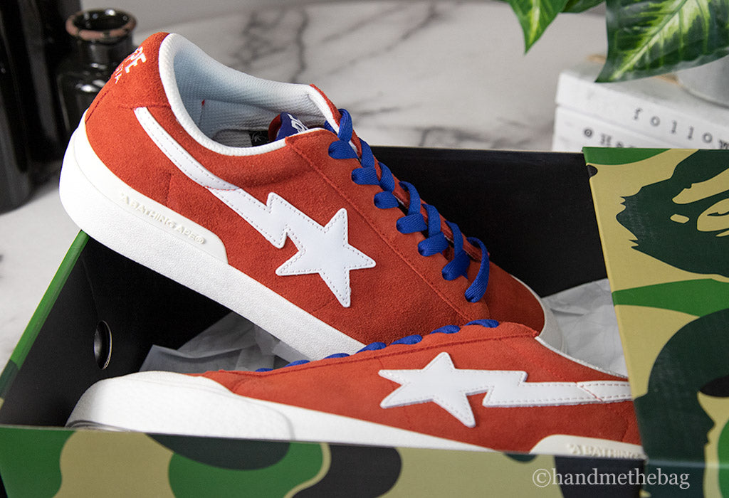 bape mad sta red blue shoes box on marble table