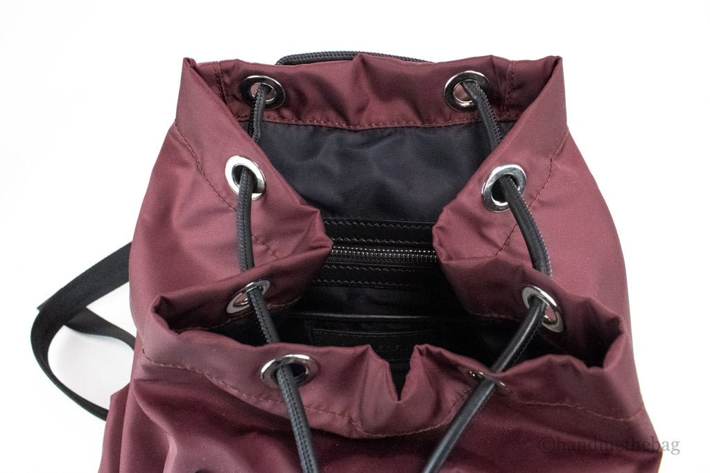 burberry burgundy nylon backpack inside on white background