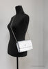versace small metallic silver evening bag on mannequin