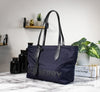 burberry navy blue nylon tote on marble table