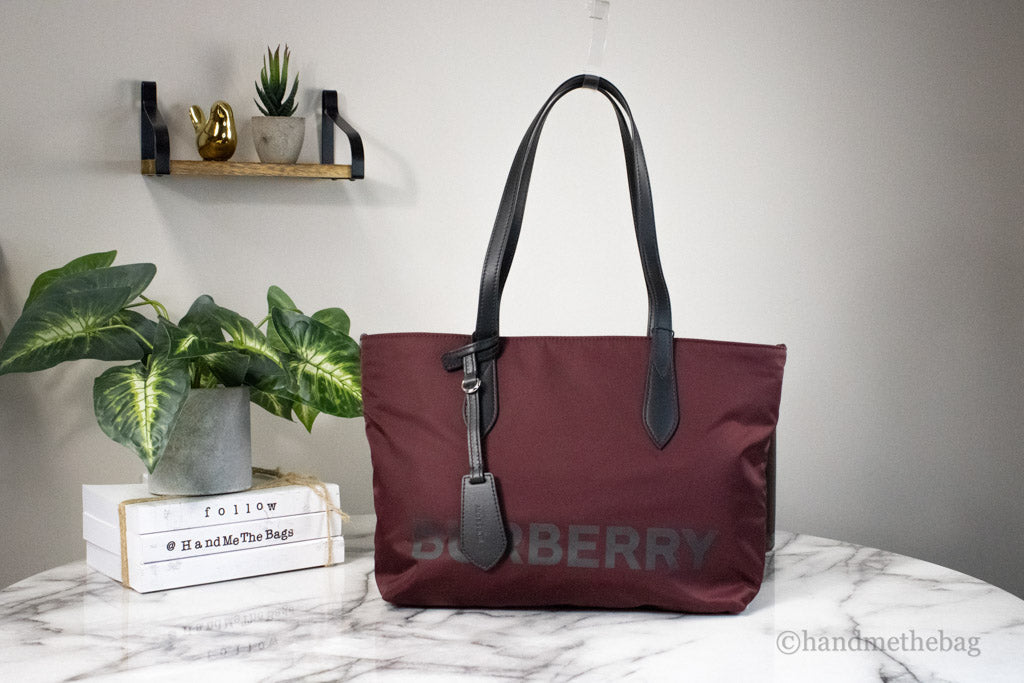 burberry burgundy nylon tote on marble table