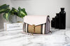 burberry macken pale orchid house check crossbody on marble table