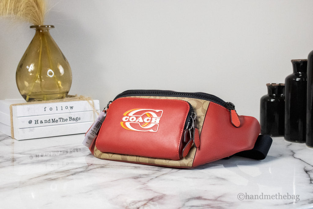 coach colorblock red track belt bag on marble table