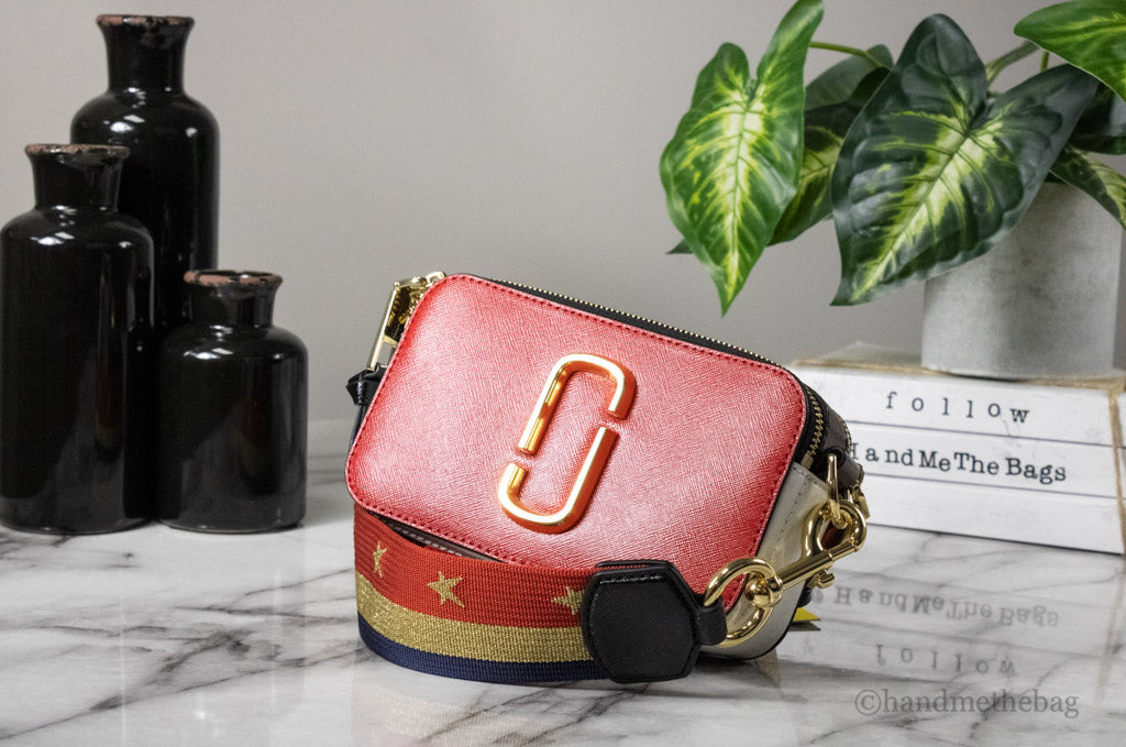 marc jacobs the americana snapshot crossbody on marble table