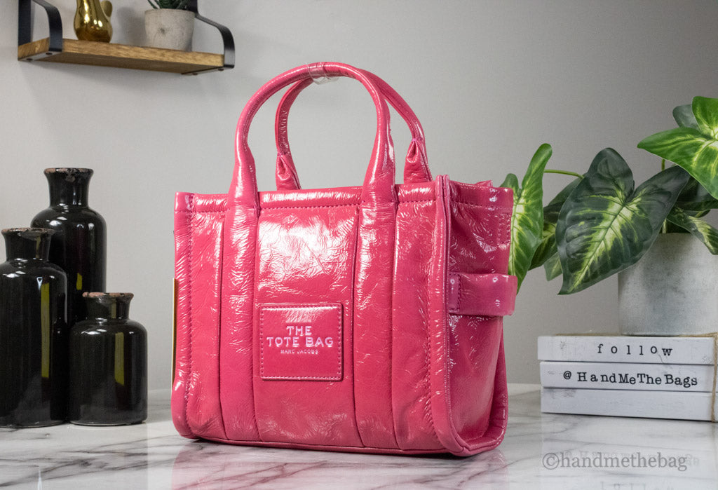 marc jacobs the shiny crinkle mini tote magenta on marble table