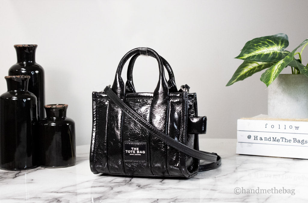 marc jacobs the shiny crinkle micro tote black on marble table